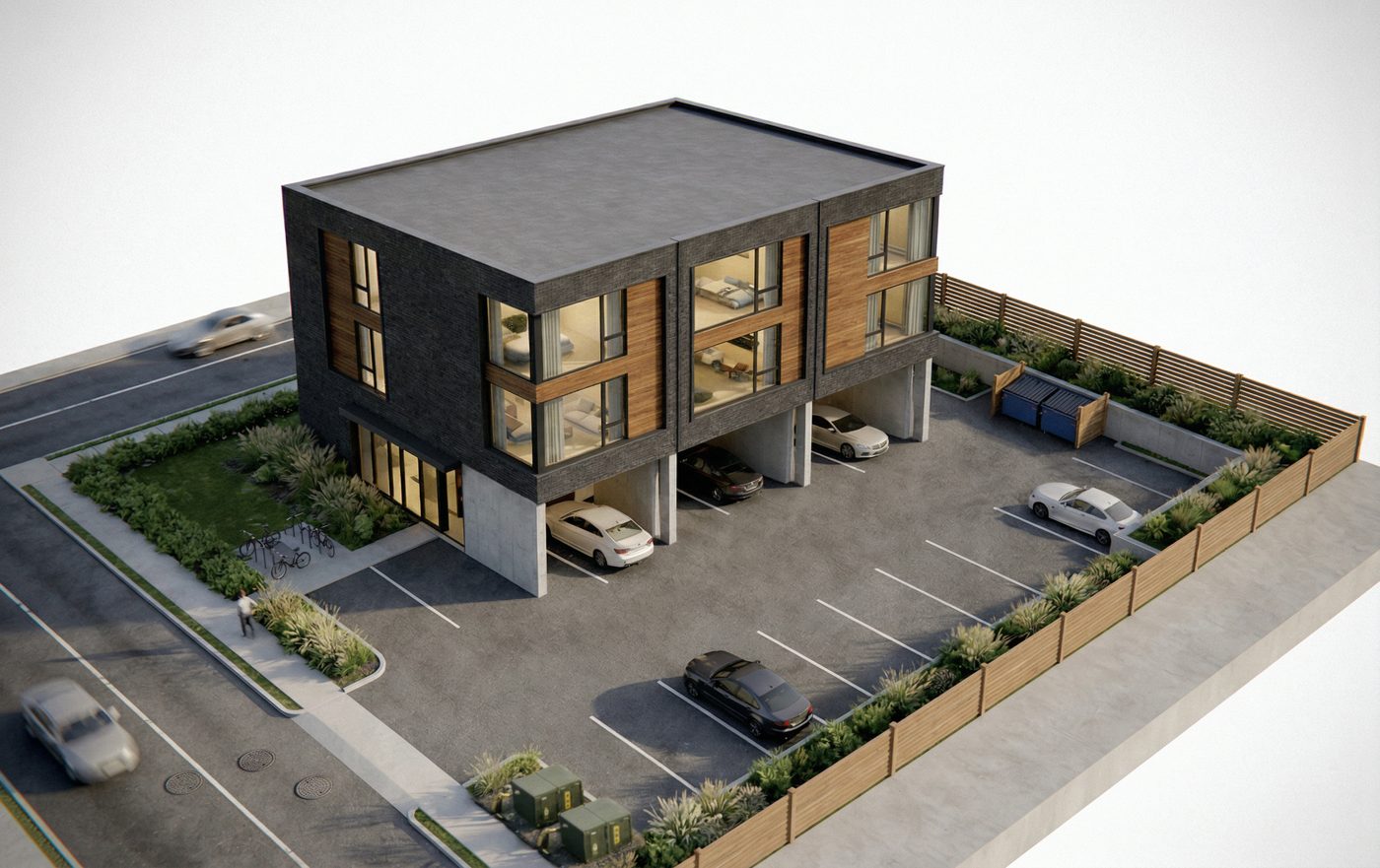 Aerial view of the 12-unit concept: the three-storey building set at the street corner with parking tucked beneath and behind it, screened by fencing and planting.